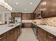 Spacious kitchen featuring dark wood cabinetry and a large island at 1575 N River Cir, Tarpon Springs, FL 34689