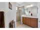 Bathroom with walk-in shower and granite vanity at 1649 Emerald Dunes Dr, Sun City Center, FL 33573