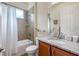 Clean bathroom with shower/tub combo, granite vanity, and updated fixtures at 1649 Emerald Dunes Dr, Sun City Center, FL 33573