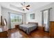 Bright bedroom with hardwood floors and large windows at 1649 Emerald Dunes Dr, Sun City Center, FL 33573