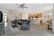 Open concept living room with kitchen and dining room views at 1649 Emerald Dunes Dr, Sun City Center, FL 33573