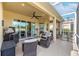 Outdoor patio area with seating and a grill at 1649 Emerald Dunes Dr, Sun City Center, FL 33573