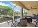 Relaxing screened porch with patio furniture and ceiling fan at 1649 Emerald Dunes Dr, Sun City Center, FL 33573