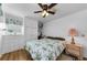 Cozy bedroom with floral bedding and wood furniture at 18675 Us Highway 19 N # 364, Clearwater, FL 33764