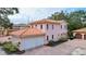 Two-story house with tile roof and two-car garage, aerial view at 1962 Freedom Dr, Clearwater, FL 33755