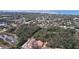 Aerial view of neighborhood, showing surrounding landscape and multiple houses at 1962 Freedom Dr, Clearwater, FL 33755