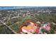 Aerial view of a house and surrounding neighborhood, showcasing the property's location and proximity to other homes at 1962 Freedom Dr, Clearwater, FL 33755