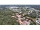 Aerial view of a community, showing numerous houses and surrounding landscape at 1962 Freedom Dr, Clearwater, FL 33755