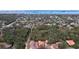 Aerial view showing a neighborhood with houses near a body of water at 1962 Freedom Dr, Clearwater, FL 33755