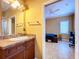 Bathroom with single vanity and adjacent bedroom at 1962 Freedom Dr, Clearwater, FL 33755