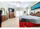 Spacious Primary bedroom with king-size bed and large TV at 1962 Freedom Dr, Clearwater, FL 33755