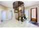 Interior entryway featuring a spiral staircase and tiled floors at 1962 Freedom Dr, Clearwater, FL 33755