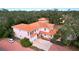 Two-story house with orange tile roof, large garage and driveway at 1962 Freedom Dr, Clearwater, FL 33755