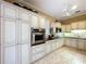 Kitchen features light-colored cabinets and a large island at 1962 Freedom Dr, Clearwater, FL 33755