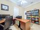 Bright office with large desk, printer, and ample bookshelves at 1962 Freedom Dr, Clearwater, FL 33755