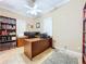 Spacious home office with built-in shelving and hardwood floors at 1962 Freedom Dr, Clearwater, FL 33755