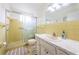 Clean bathroom with shower/tub combo and vanity at 2071 Australia W Way # 17, Clearwater, FL 33763