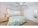 King-size bed, nightstands, and large window in this bright bedroom at 2071 Australia W Way # 17, Clearwater, FL 33763