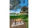 Park bench overlooking a pond and gazebo at 2071 Australia W Way # 17, Clearwater, FL 33763