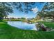 Serene pond with gazebo and lush landscaping at 2071 Australia W Way # 17, Clearwater, FL 33763