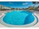 Crystal-clear community pool with surrounding deck at 2071 Australia W Way # 17, Clearwater, FL 33763