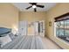 Main bedroom with pool view and access to bathroom at 2102 Golf Manor Blvd, Valrico, FL 33596