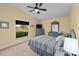 Bedroom with large window overlooking backyard at 2102 Golf Manor Blvd, Valrico, FL 33596