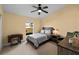 Cozy bedroom with a queen-sized bed and ample natural light at 2102 Golf Manor Blvd, Valrico, FL 33596