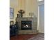 Stone fireplace with candles creating a warm and inviting ambiance at 2102 Golf Manor Blvd, Valrico, FL 33596