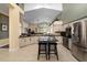 Spacious kitchen featuring granite countertops, stainless steel appliances, and an island at 2102 Golf Manor Blvd, Valrico, FL 33596