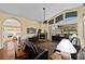 Living room with hardwood floors, fireplace, and view of Primary bedroom at 2102 Golf Manor Blvd, Valrico, FL 33596