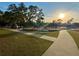 playground with play structures and benches under large tree at 2102 Golf Manor Blvd, Valrico, FL 33596