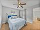 Spacious bedroom with blue accents and ceiling fan at 2104 W Okaloosa Ave, Tampa, FL 33604