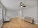 Open living area with hardwood floors and a ceiling fan at 2104 W Okaloosa Ave, Tampa, FL 33604