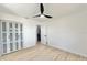 Spacious bedroom with light flooring and closet at 2142 Hickory Gate W Dr, Dunedin, FL 34698