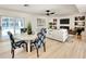 Casual dining area with white table and pool view at 2142 Hickory Gate W Dr, Dunedin, FL 34698