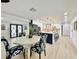 Bright dining area with octagonal table and patterned chairs at 2142 Hickory Gate W Dr, Dunedin, FL 34698