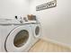 Bright laundry room with Samsung washer and dryer at 2142 Hickory Gate W Dr, Dunedin, FL 34698