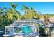 Screened-in rectangular pool with spa at 2142 Hickory Gate W Dr, Dunedin, FL 34698