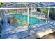 Enclosed pool and spa with waterfall feature at 2142 Hickory Gate W Dr, Dunedin, FL 34698