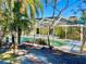 Relaxing pool area with screened enclosure at 2142 Hickory Gate W Dr, Dunedin, FL 34698