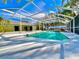 Inviting, large screened-in swimming pool at 2142 Hickory Gate W Dr, Dunedin, FL 34698