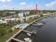 Aerial view showcasing waterfront property, boat slips, and community pool at 2424 W Tampa Bay Blvd # L102, Tampa, FL 33607