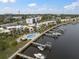 Aerial view of waterfront property with community pool and boat docks at 2424 W Tampa Bay Blvd # L102, Tampa, FL 33607