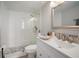 Modern bathroom with white vanity, walk-in shower, and pebble floor at 2424 W Tampa Bay Blvd # L102, Tampa, FL 33607