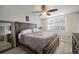 Bright bedroom featuring a comfortable bed and window shutters at 2424 W Tampa Bay Blvd # L102, Tampa, FL 33607