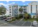 Exterior view of a condo building with parking and landscaping at 2424 W Tampa Bay Blvd # L102, Tampa, FL 33607