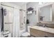 Clean bathroom with tub, shower, and granite vanity at 2506 N Rocky Point Dr # 355, Tampa, FL 33607