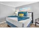 Comfortable bedroom with a king-size bed and coastal decor at 2506 N Rocky Point Dr # 355, Tampa, FL 33607