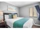 Well-lit bedroom featuring a queen-size bed and tasteful decor at 2506 N Rocky Point Dr # 355, Tampa, FL 33607